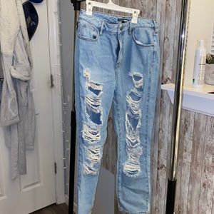 Worn once light washed ripped jeans.